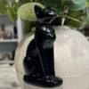 Black obsidian Bastet cat goddess statue 10cm angled view of collar and pendant Black obsidian Bastet cat goddess statue 10cm angled view of collar and pendant