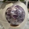 Dream amethyst sphere C 70mm with sunburst flower pattern Dream amethyst sphere C 70mm with sunburst flower pattern