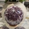 Dream amethyst sphere D 72mm with purple honeycomb crystal pattern Dream amethyst sphere D 72mm with purple honeycomb crystal pattern