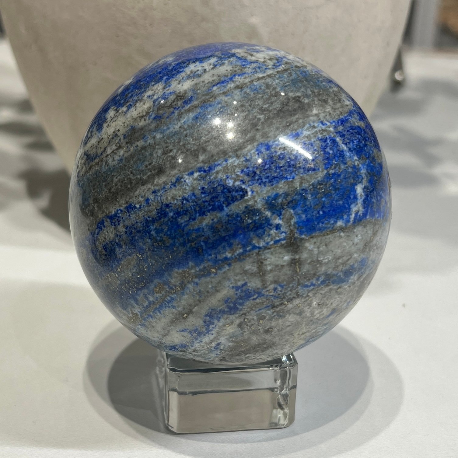 Lapis lazuli sphere A 80mm with cobalt blue bands and grey calcite Lapis lazuli sphere A 80mm with cobalt blue bands and grey calcite