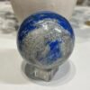 Lapis lazuli sphere A 80mm with bright blue patch and pyrite flecks Lapis lazuli sphere A 80mm with bright blue patch and pyrite flecks