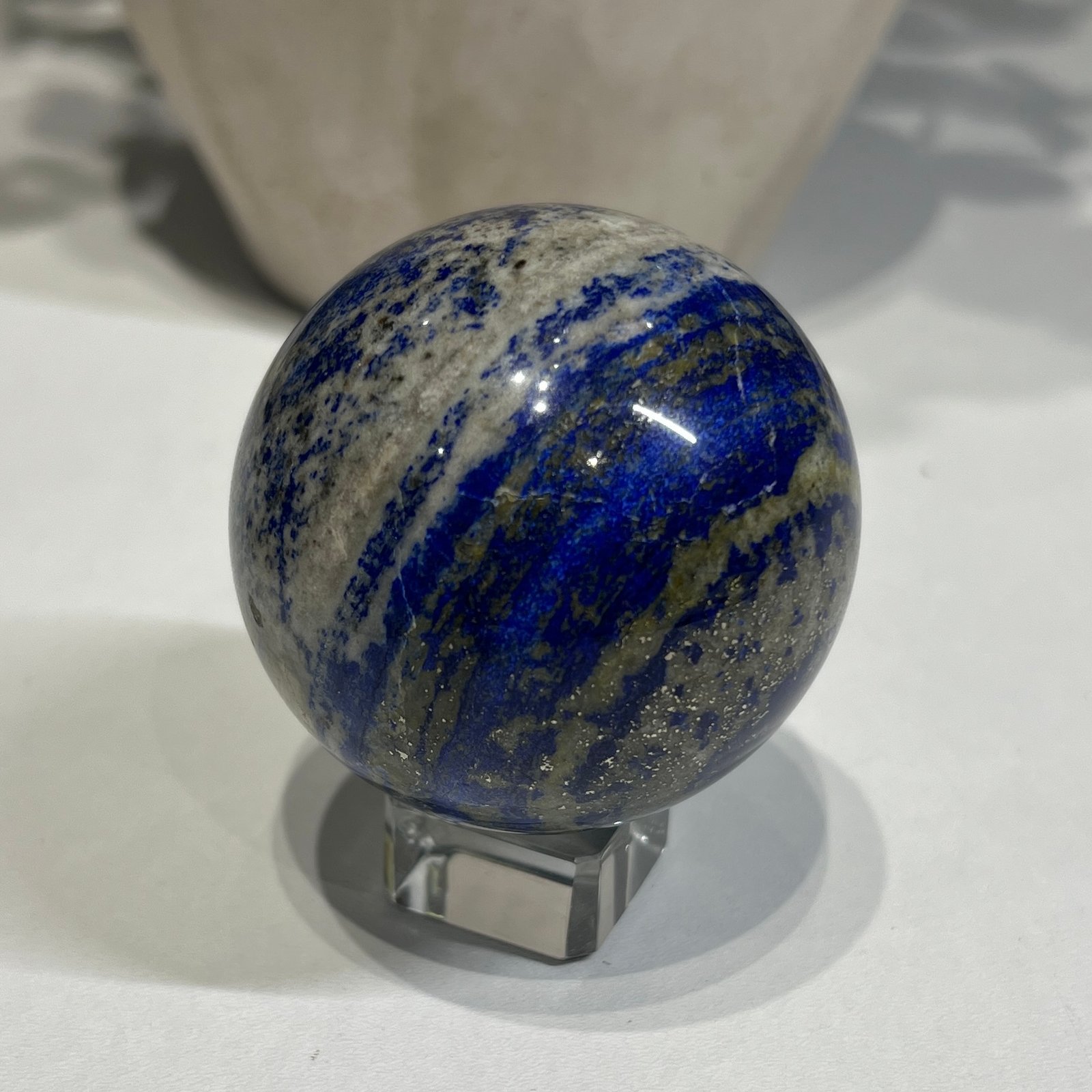 Lapis lazuli sphere B 58mm with gold pyrite bands Lapis lazuli sphere B 58mm with gold pyrite bands