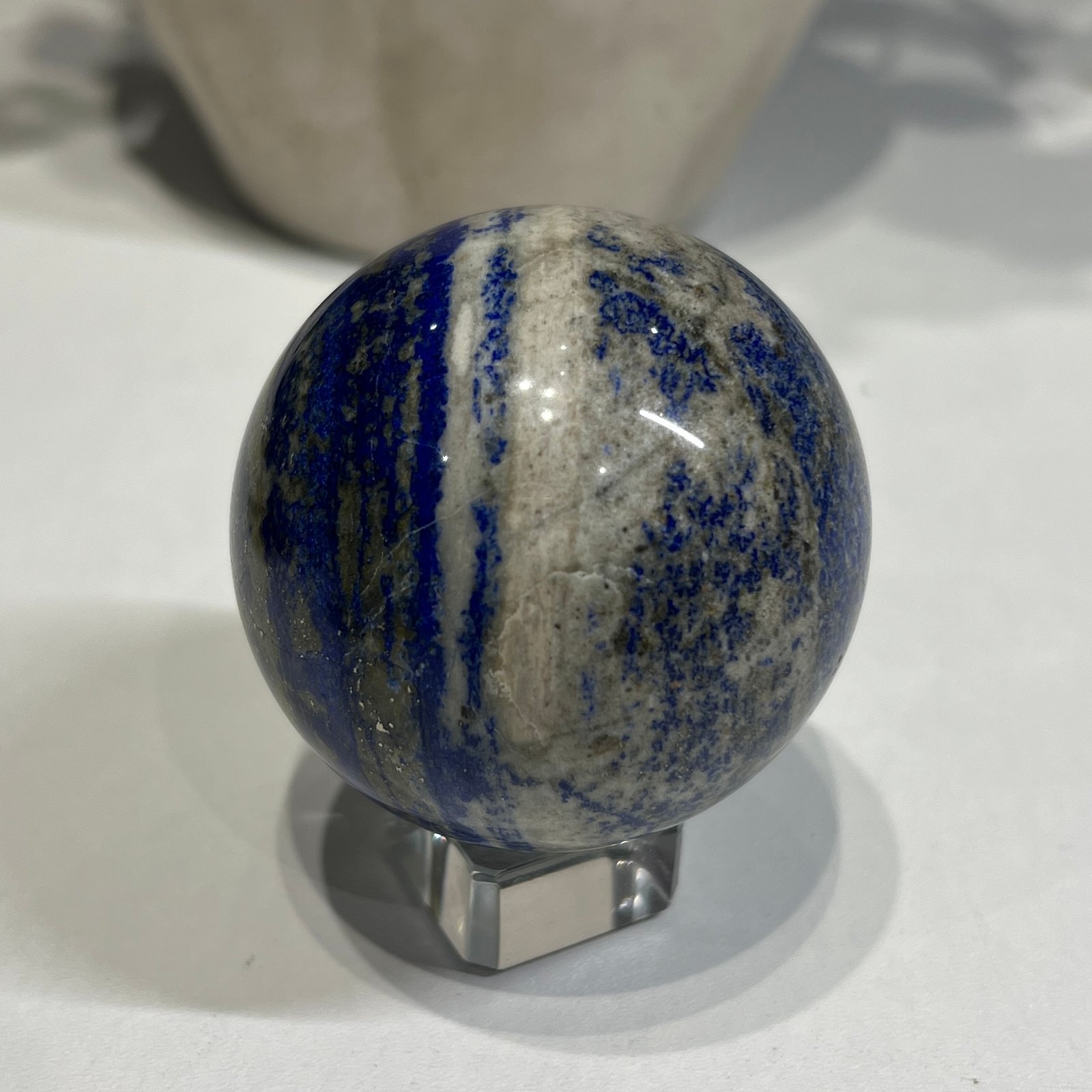 Lapis lazuli sphere B 58mm with cream calcite stripe Lapis lazuli sphere B 58mm with cream calcite stripe
