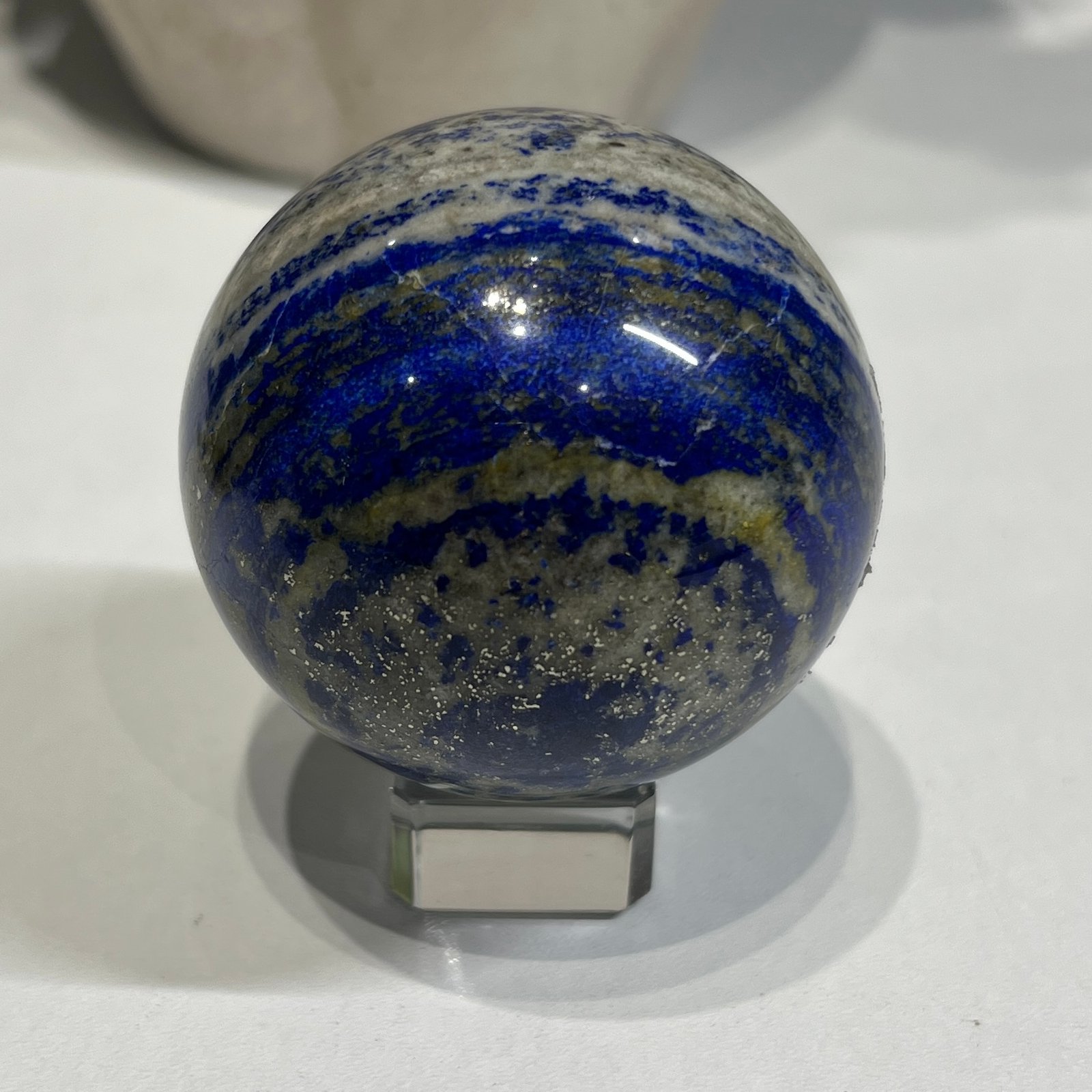 Lapis lazuli sphere B 58mm with glittering pyrite Lapis lazuli sphere B 58mm with glittering pyrite