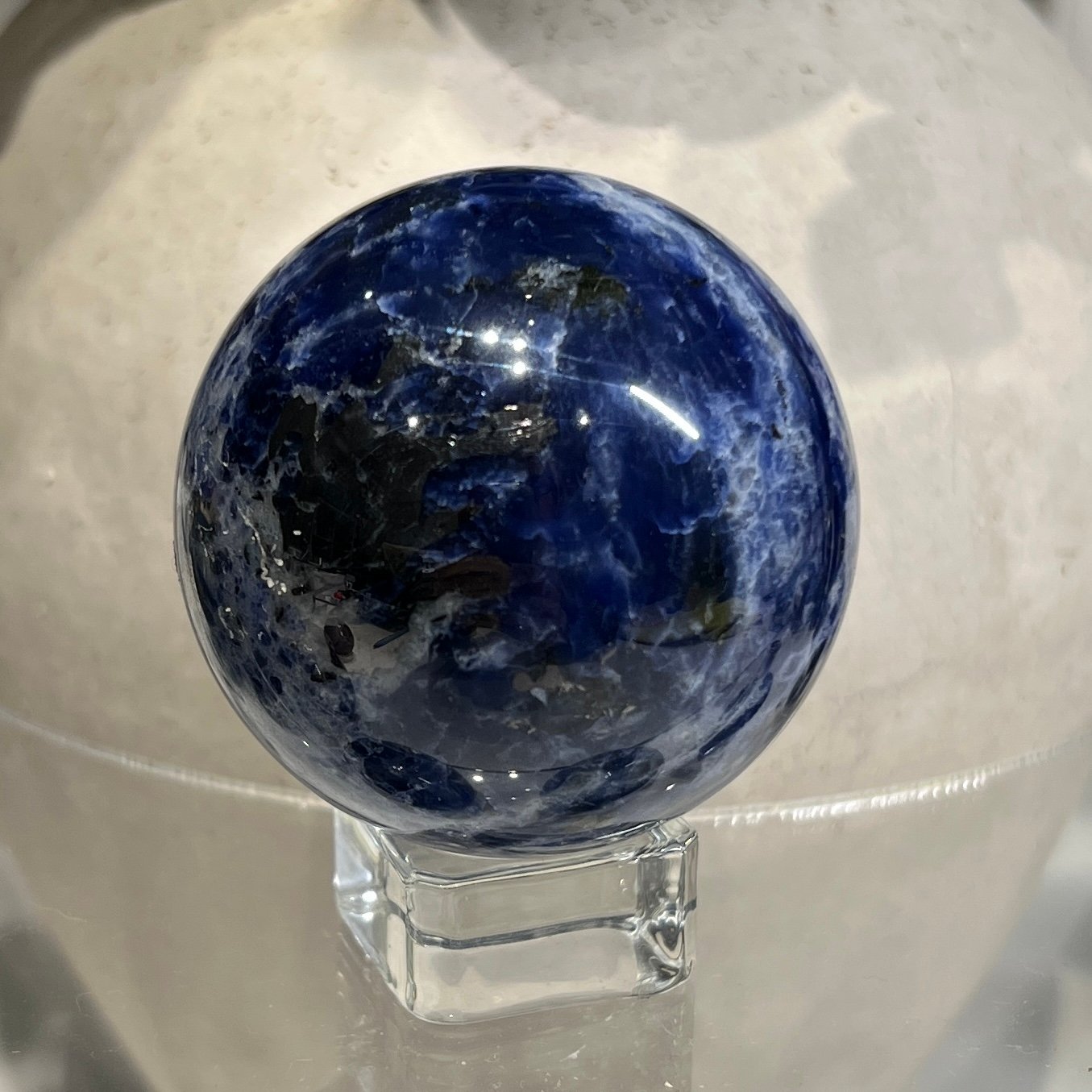 Sodalite sphere C 53mm, dark navy with blue and white patch Sodalite sphere C 53mm, dark navy with blue and white patch