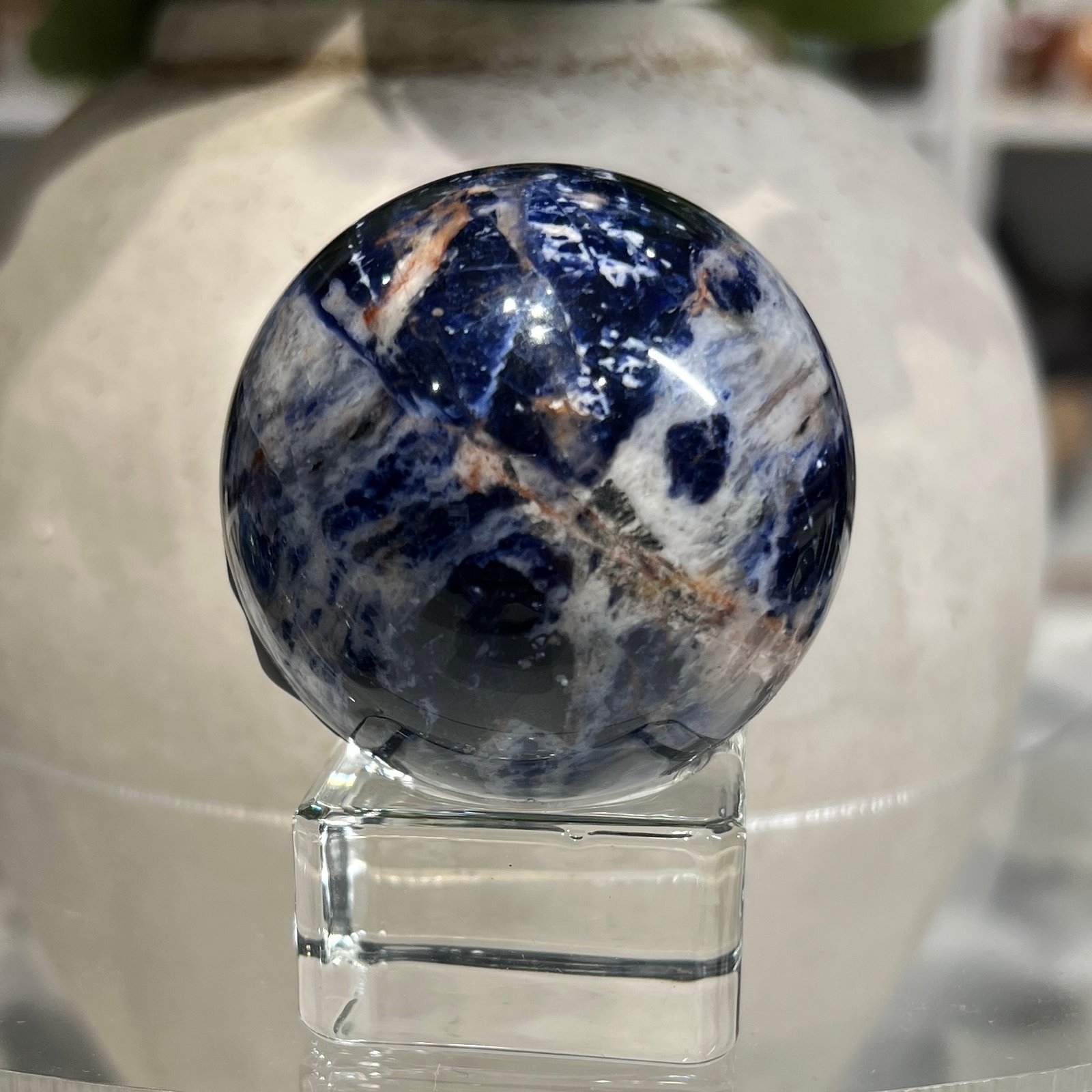 Sodalite sphere E 49mm, bold blue and white with orange lines Sodalite sphere E 49mm, bold blue and white with orange lines