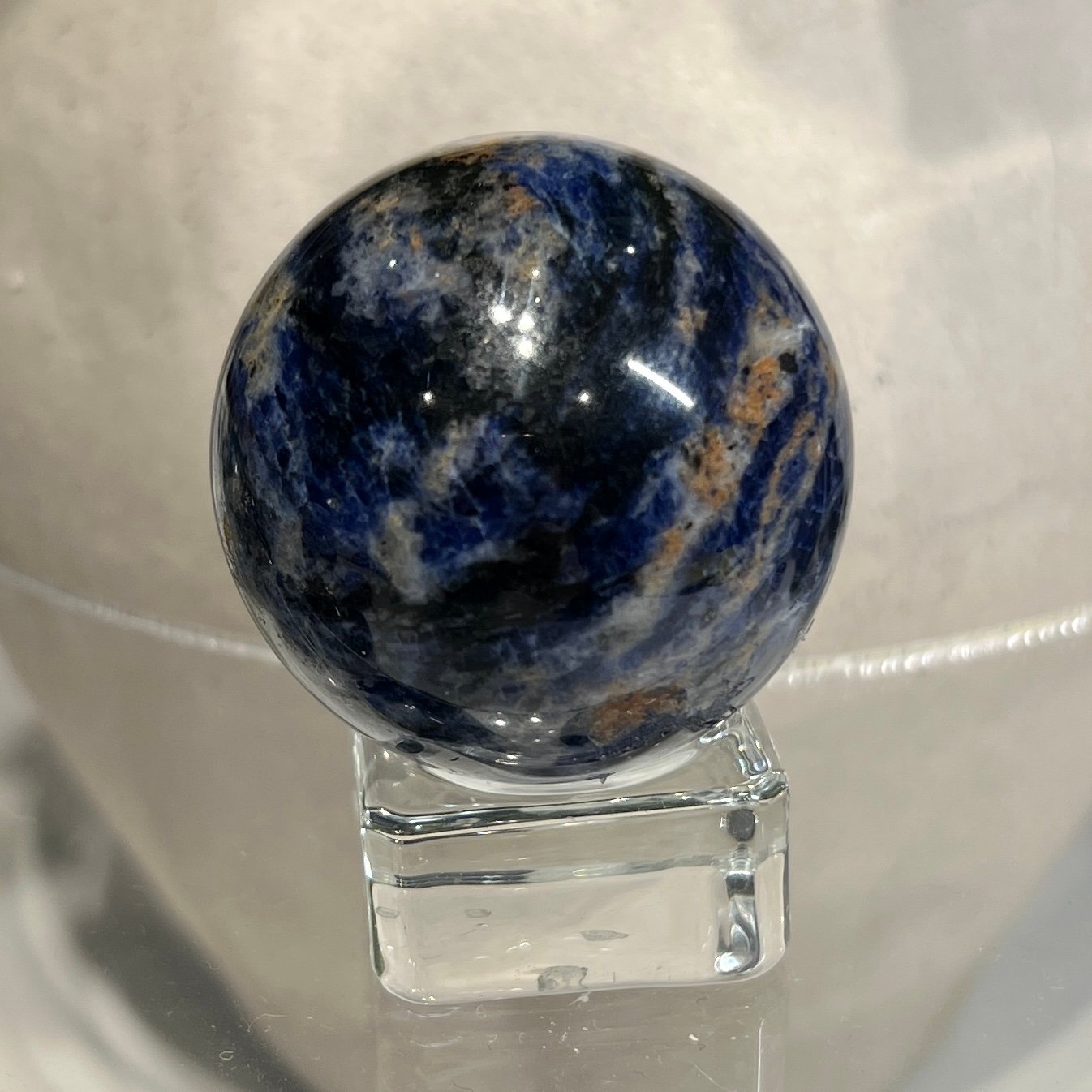 Sodalite sphere G 42mm, blue with peach and tan patches Sodalite sphere G 42mm, blue with peach and tan patches