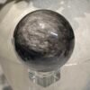 Silver sheen obsidian sphere G 58mm with swirling silver sheen Silver sheen obsidian sphere G 58mm with swirling silver sheen