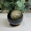 Gold sheen obsidian sphere A, 70mm, with broad golden sheen across the top Gold sheen obsidian sphere A, 70mm, with broad golden sheen across the top