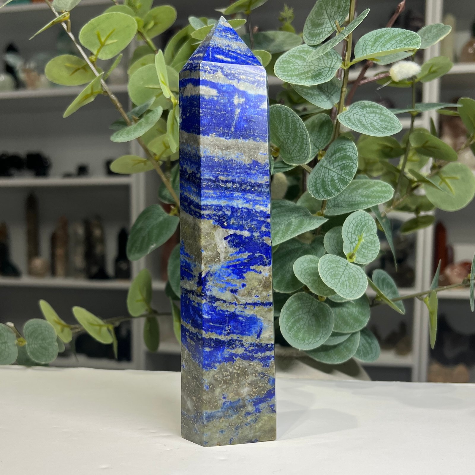 lapis lazuli tower large 18cm side Large lapis lazuli tower 18cm side view showing blue banding and pyrite