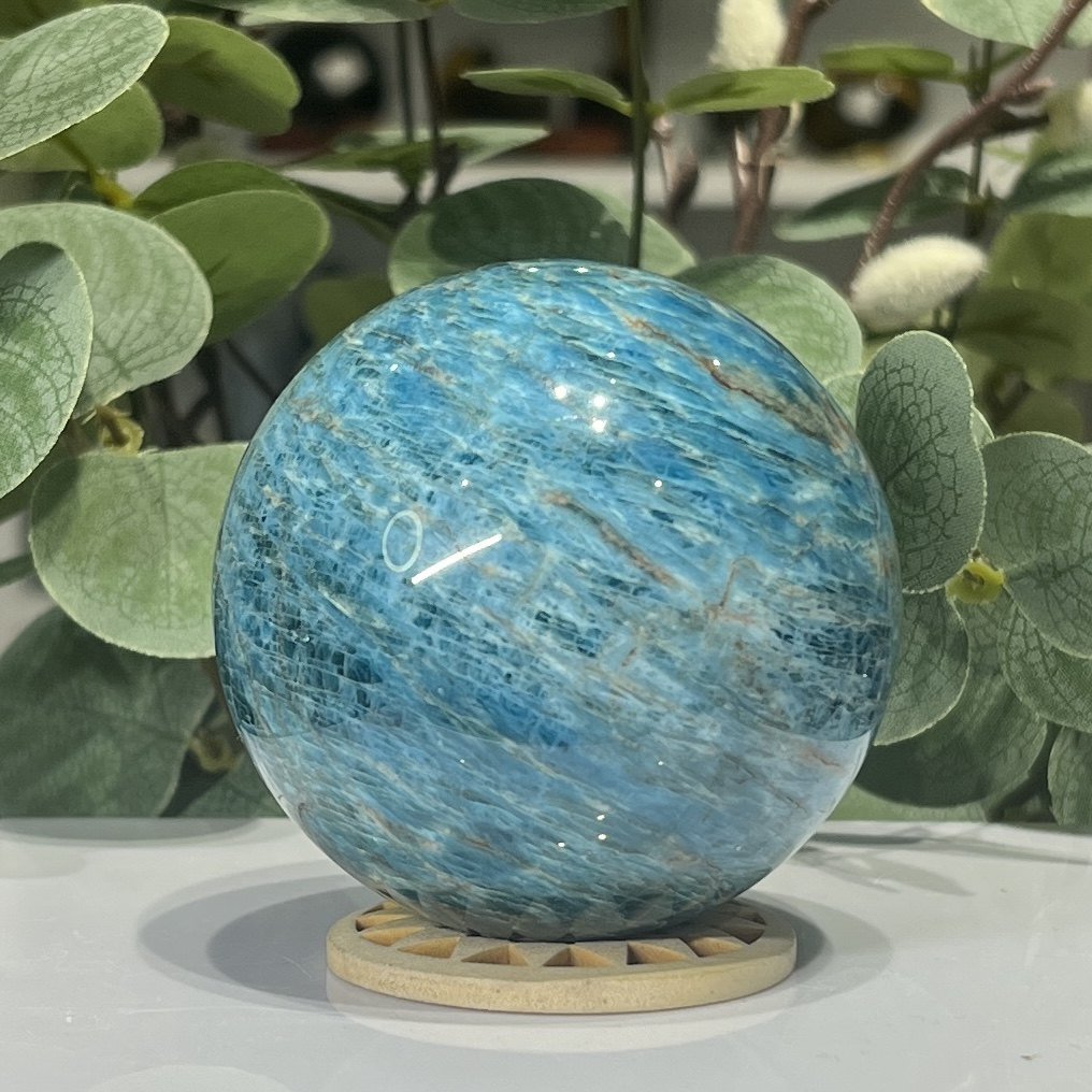 Blue apatite sphere second side showing deeper teal patches