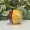 Mookaite Sphere Mookaite sphere E 57mm on a wooden stand, half mustard yellow and half brick red, Mystic Grove UK