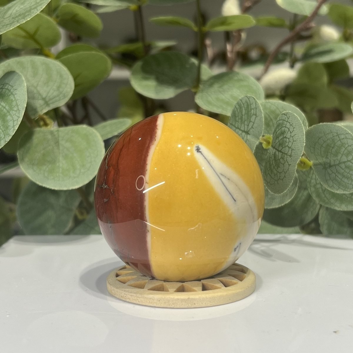 Mookaite Sphere Mookaite sphere E 57mm on a wooden stand, half mustard yellow and half brick red, Mystic Grove UK