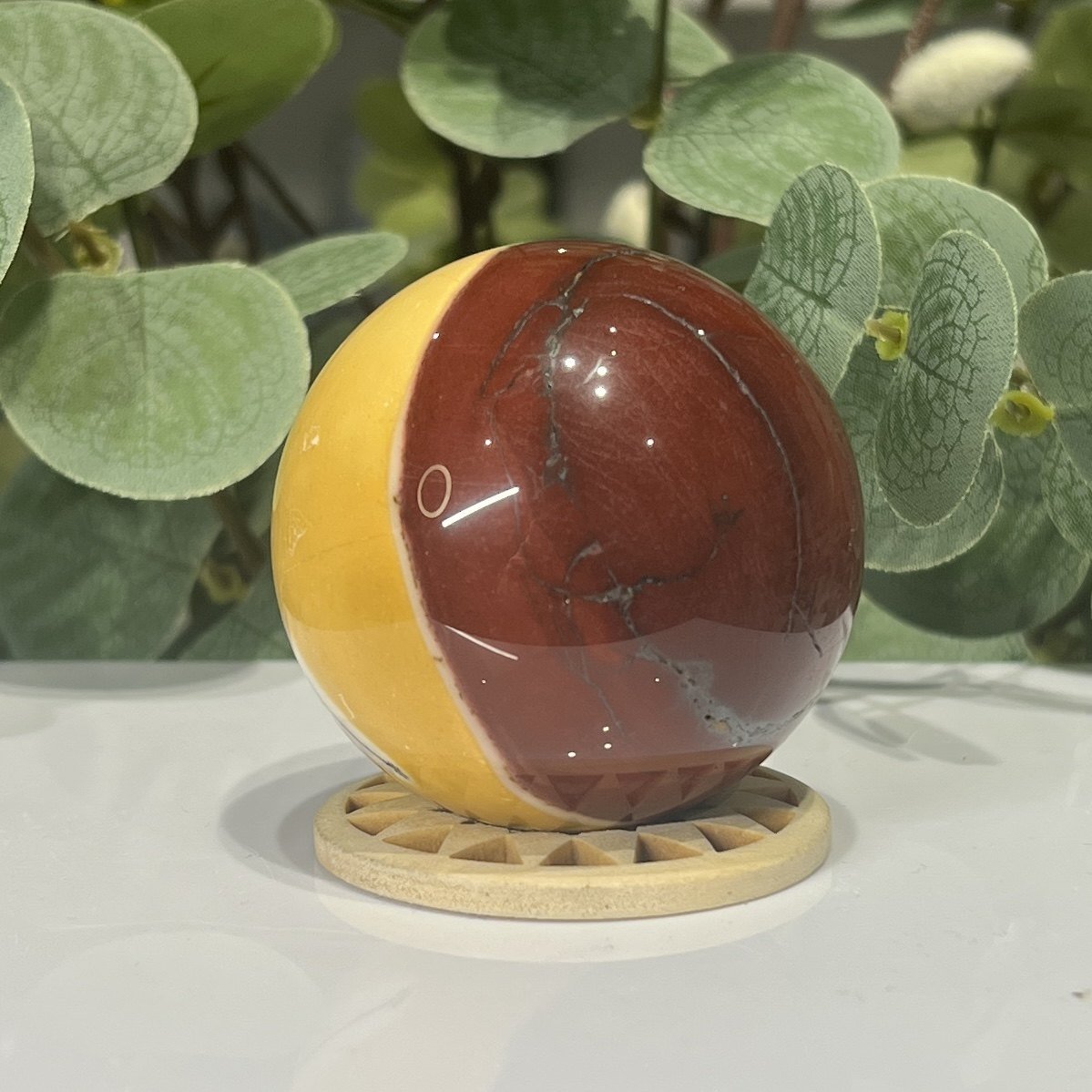 Mookaite Sphere Mookaite sphere E second side, brick red with a cream line