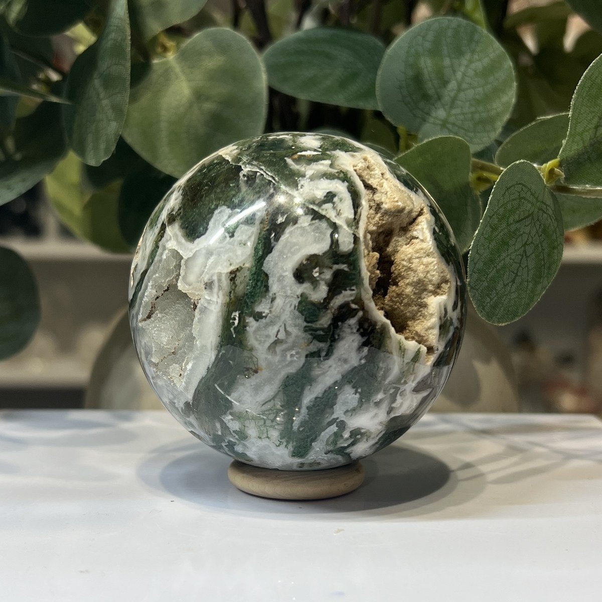 Moss agate sphere E, 70mm, white and green with a golden druzy pocket