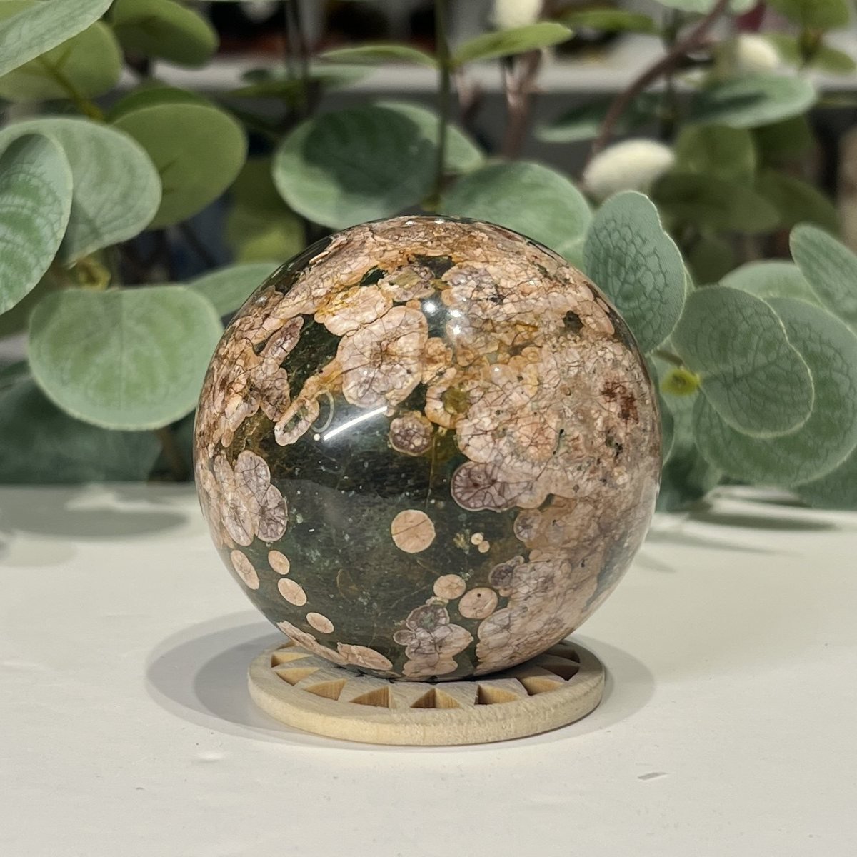 Ocean Jasper Sphere 63mm Ocean jasper sphere close view of the pink orbs over green
