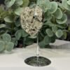 Pyrite heart on stand, side view Pyrite heart on stand, side view