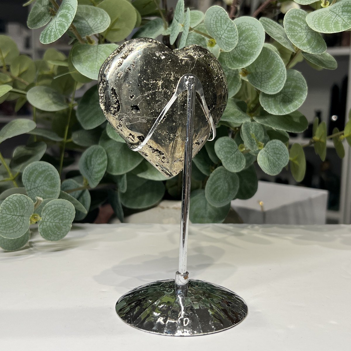 Pyrite heart on stand, back with crystal pockets Pyrite heart on stand, back with crystal pockets