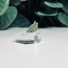 Seven pieces of genuine raw Czech moldavite on clear stands