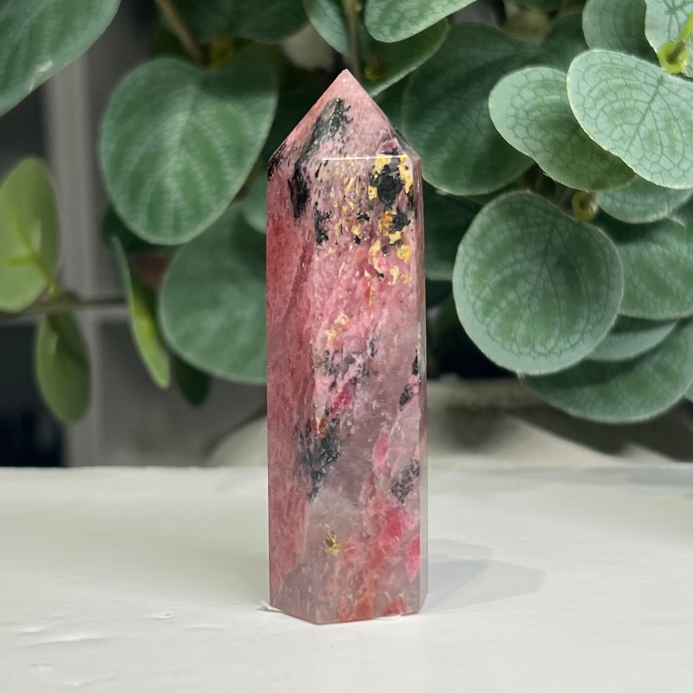 rhodonite tower c 8cm Rhodonite tower C 8cm, pale pink rhodonite with black and golden flecks