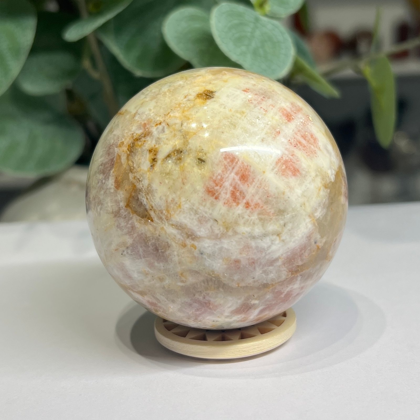 sunstone sphere 6cm 2 Sunstone sphere 6cm showing bright peach sunstone patches