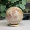 sunstone sphere 6cm 5 Sunstone sphere 6cm, peach sunstone and cream feldspar side view