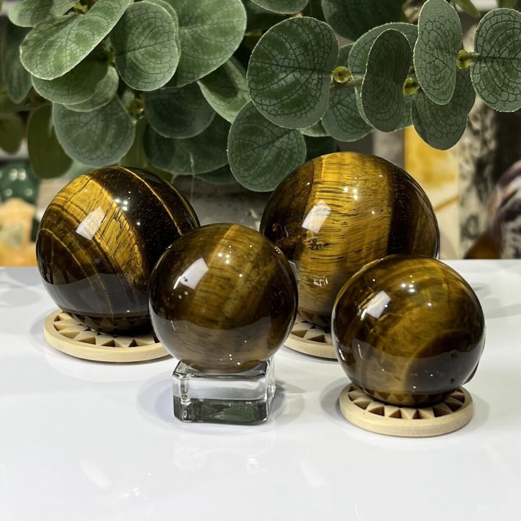 Tigers eye spheres on wooden stands, group