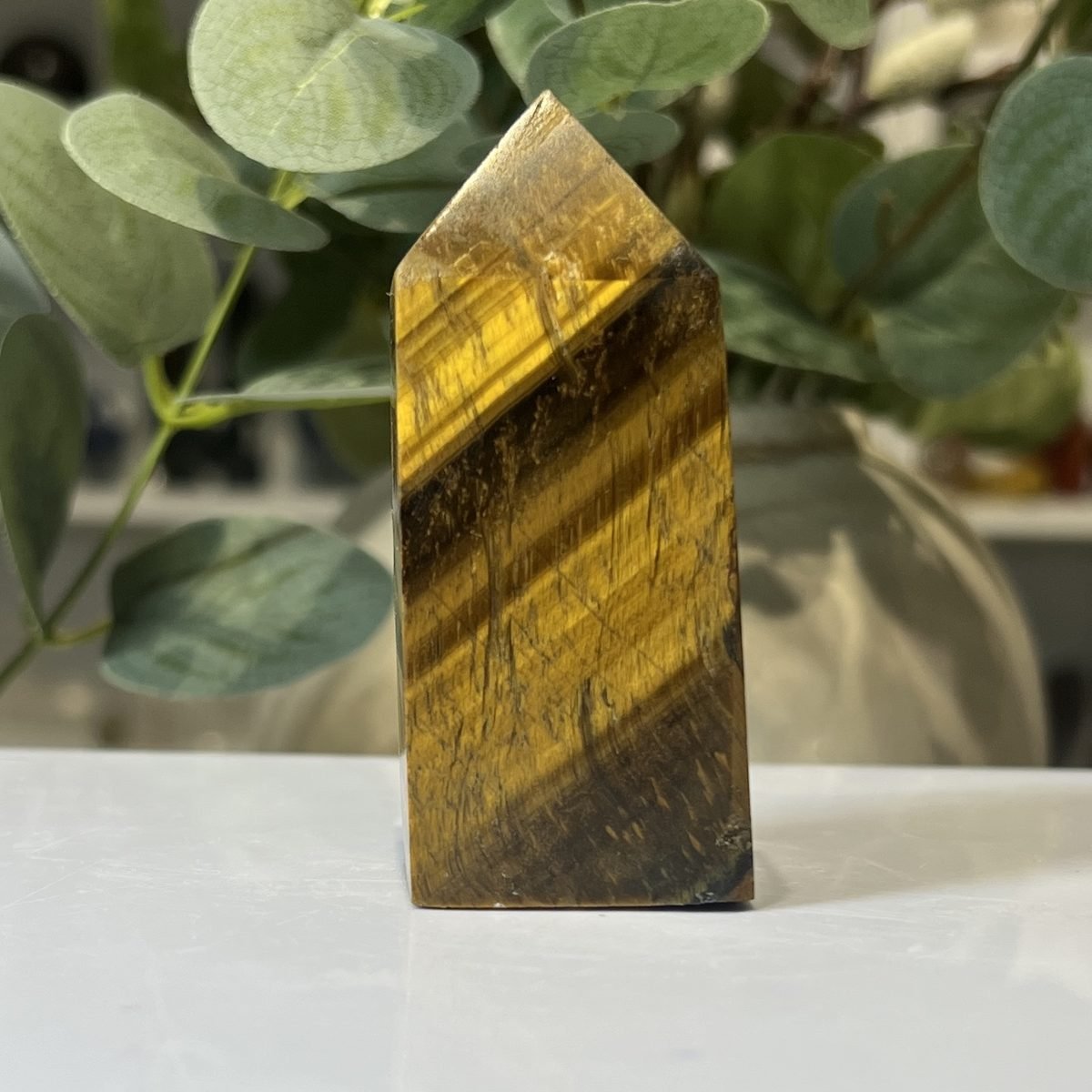 Tigers eye tower A Tigers eye tower A, polished point